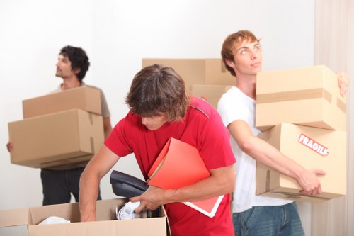 Professional movers loading items for a local Barking relocation