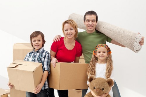 Packed moving boxes inside a Barking apartment ready for collection