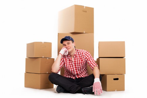 Boxes and furniture being loaded into a moving van in Barking